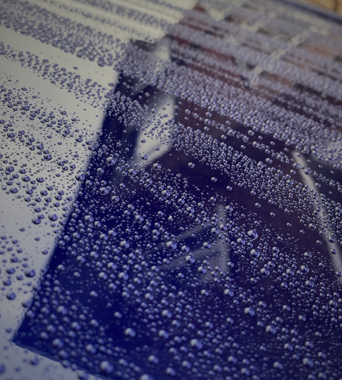 Water beading on ceramic-protected purple paint